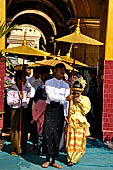 Ear piercing ceremony at Mahamuni Buddha Temple, Myanmar 